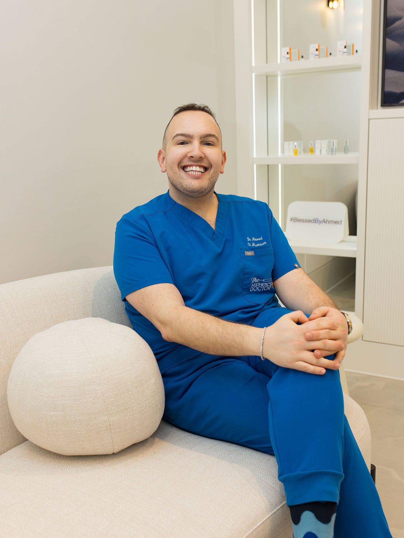 ahmed in new clinic reception on sofa