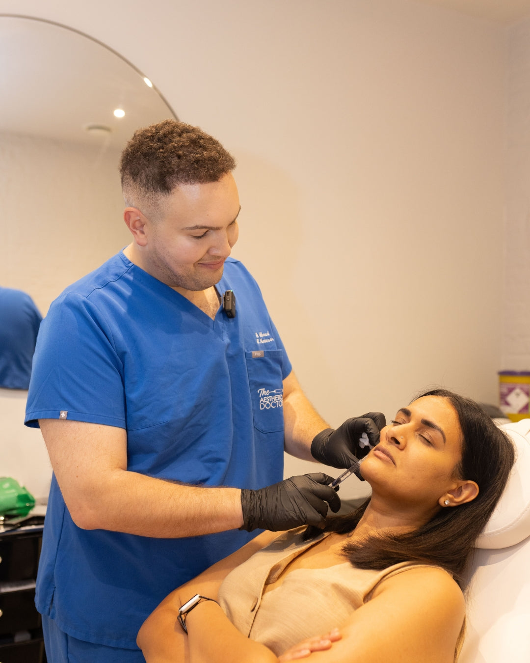 Dr Ahmed performing Dermal Filler on a patient 