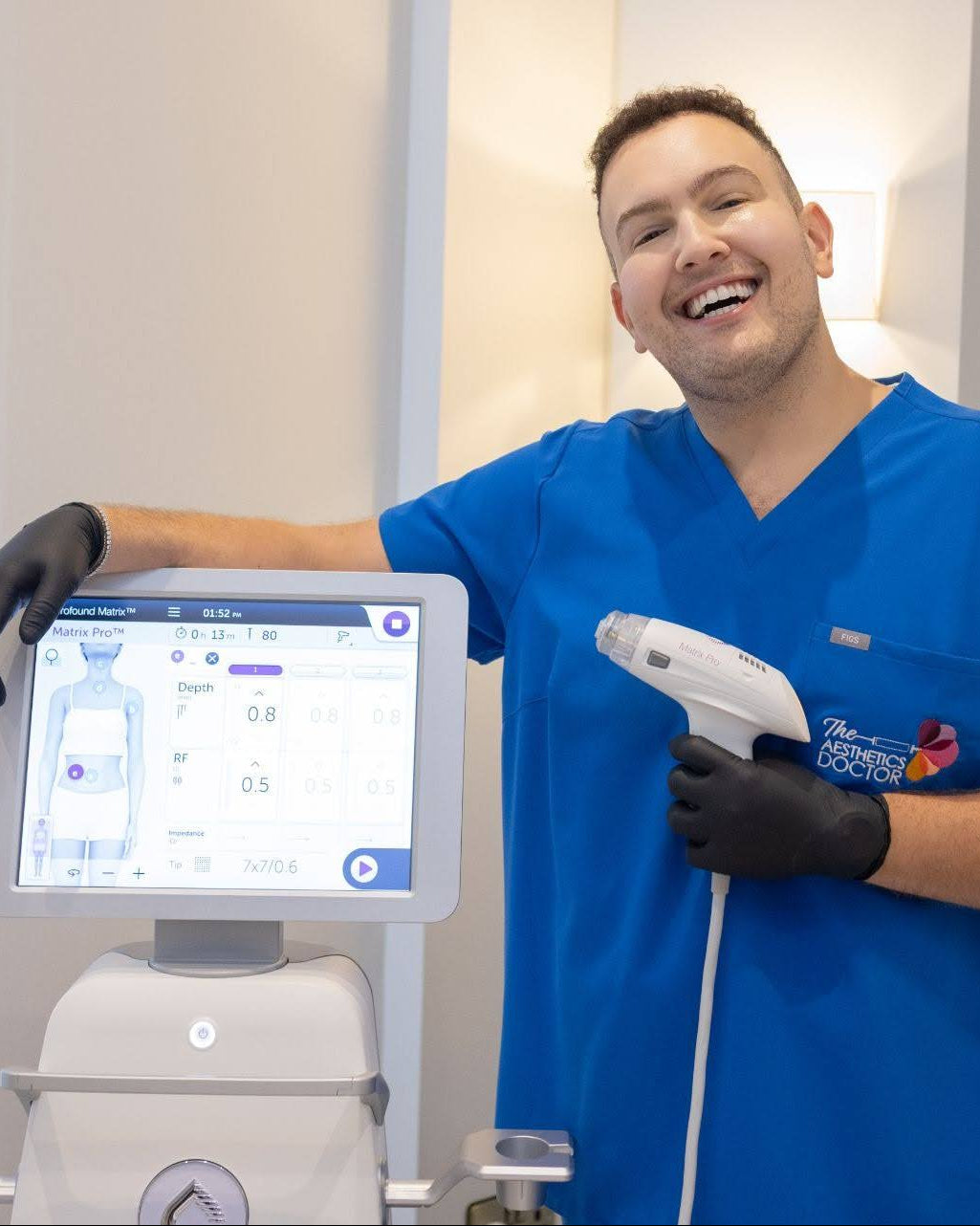 Dr ahmed stood next to the matrix pro RD machine